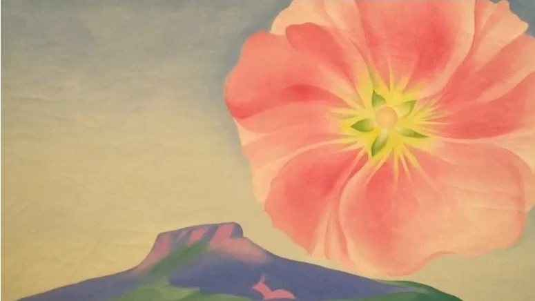 Painting of a large coral flower above a desert hill